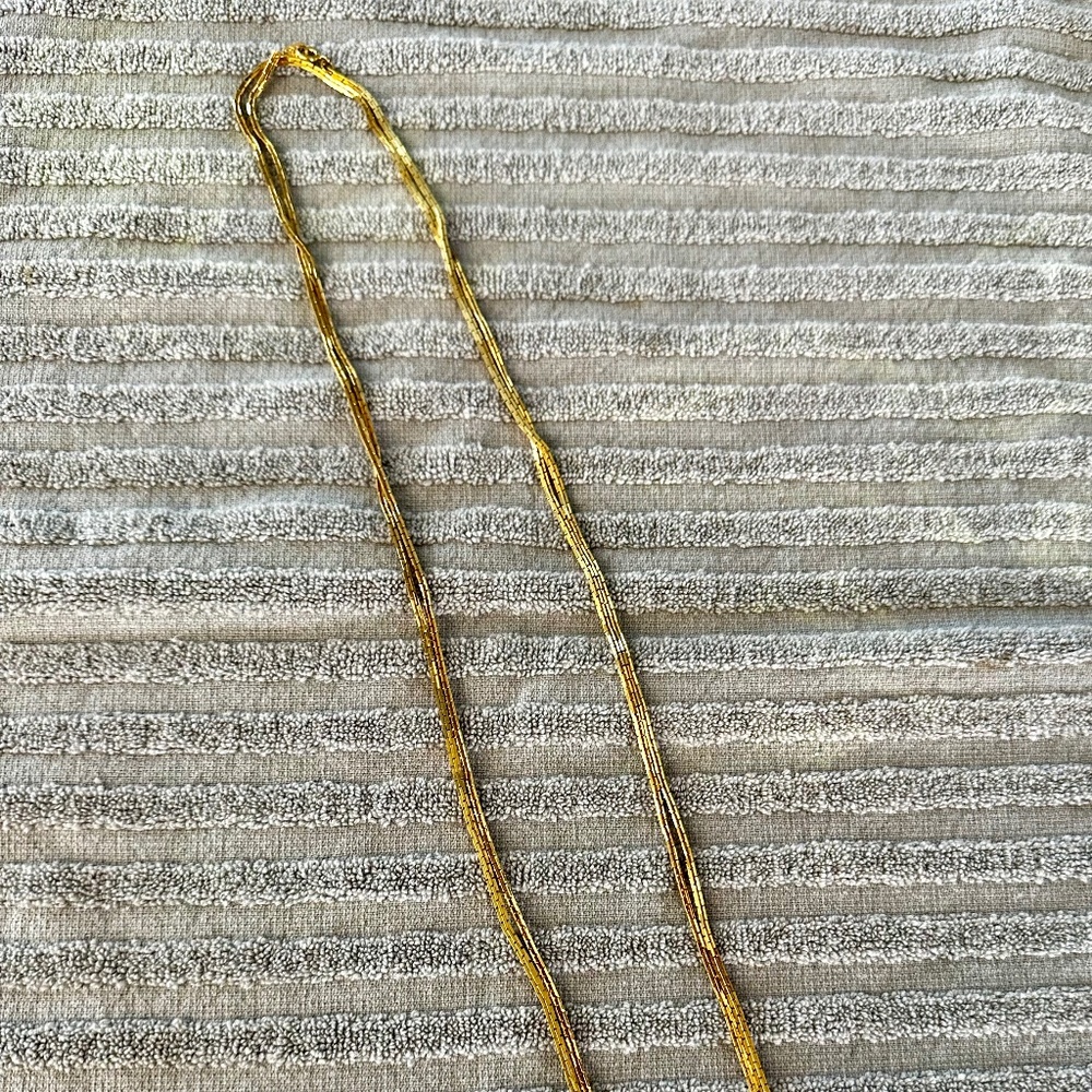 Bright gold tone necklace, 60" for versatility